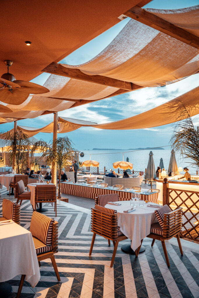 Photo of the Bambino Ibiza terrace as the lights come on and warm up the restaurant's atmosphere